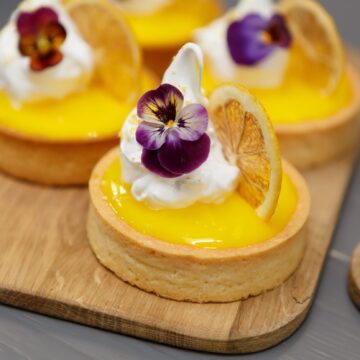Shortbread tart cakes with dried lemons and cream. Delicious dessert food baked in a pastry cafe for lunch